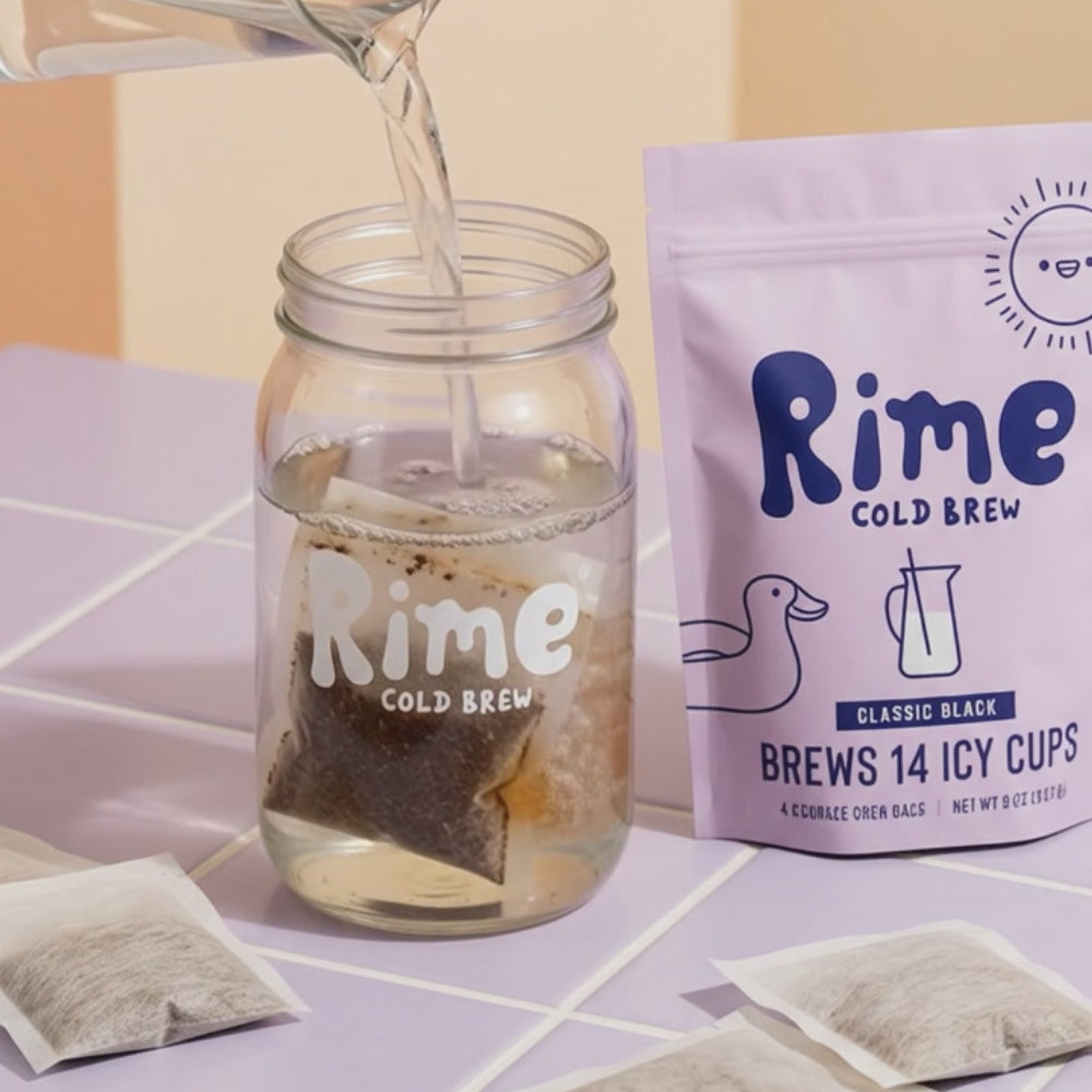 Water is poured into a jar of cold brew